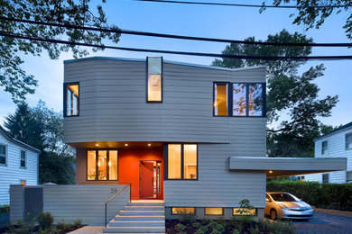 Mid-sized trendy gray two-story exterior home photo in New York
