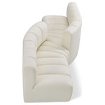 Meridian Furniture - Arc Vegan Leather Upholstered 4-Pc. Facing Modular Sectional, Cream - Unleash modern opulence with the Arc Vegan Leather 4pc. Sectional. Crafted for the modern connoisseur, this Sectional injects an air of refined luxury into any space. Its sleek silhouette, upholstered in supple cream vegan leather, exudes timeless sophistication while the deep channel tufting adds textural intrigue, further elevating the chair's visual appeal. The modular design makes it a versatile chameleon, effortlessly adapting to your evolving needs and preferences. Whether you envision it gracing a chic living room corner, basking in the glow of a bedroom window, or adding a touch of drama to a home office, the Arc seamlessly complements your unique interior aesthetic.