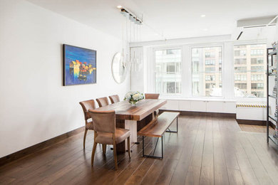 Large trendy dark wood floor and white floor kitchen/dining room combo photo in New York with white walls and no fireplace