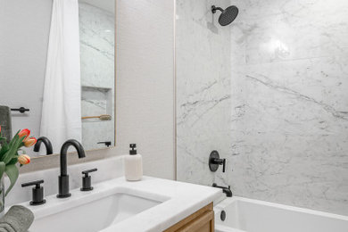 Inspiration for a small modern master white tile and porcelain tile porcelain tile, gray floor, single-sink and wallpaper bathroom remodel in Dallas with shaker cabinets, light wood cabinets, a two-piece toilet, beige walls, an undermount sink, marble countertops, white countertops, a niche and a built-in vanity