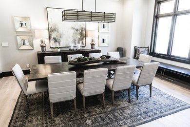 Inspiration for a large contemporary light wood floor and beige floor enclosed dining room remodel in Salt Lake City with beige walls and no fireplace