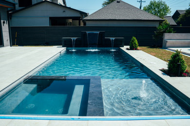 Inspiration for a large modern backyard concrete paver and rectangular natural pool landscaping remodel in Dallas