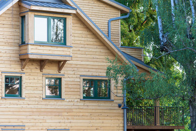 Inspiration for an eclectic two-storey exterior in Portland with wood siding.