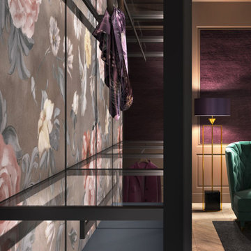 Modern master closet with glass closet system and floral wallpaper