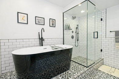 Mid-sized eclectic master white tile and subway tile porcelain tile, gray floor and single-sink bathroom photo in Toronto with shaker cabinets, gray cabinets, a one-piece toilet, white walls, an undermount sink, quartzite countertops, a hinged shower door, white countertops and a built-in vanity
