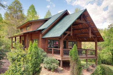 Large mountain style side porch idea in Other with a roof extension