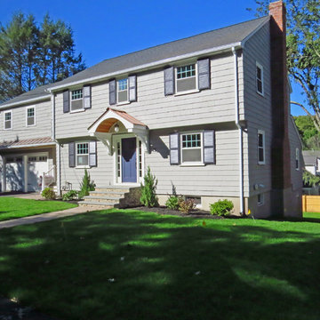 The new facade, painted in a color scheme of taupe and blueberry respects