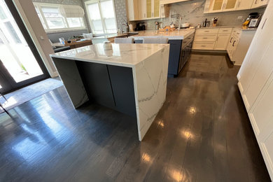 Inspiration for a large u-shaped eat-in kitchen remodel in Chicago with gray cabinets, two islands and white countertops