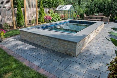 Mid-sized elegant backyard concrete paver patio photo in Chicago