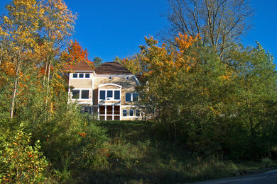Arts and crafts beige two-story mixed siding exterior home photo in Cincinnati