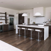Classic dark cabinets kitchen with travertine floors