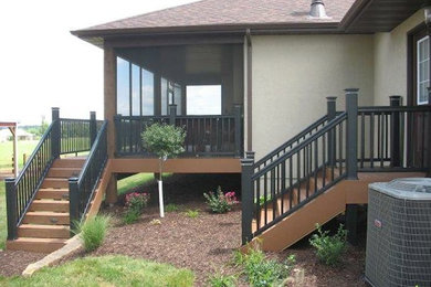 Arts and crafts back porch photo in Other with decking and a roof extension