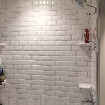 Kohler plumbing and beveled subway tile