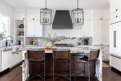 Example of a large transitional u-shaped dark wood floor and brown floor eat-in kitchen design in Sacramento with a farmhouse sink, shaker cabinets, white cabinets, granite countertops, multicolored backsplash, granite backsplash, paneled appliances, an island and multicolored countertops