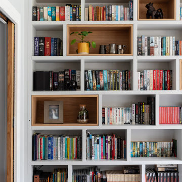 LUXURY FULLY FITTED LIVING ROOM WITH BESPOKE BOOKCASES AND MEDIA WALL