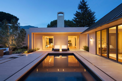 Trendy stone and rectangular pool photo in Santa Barbara