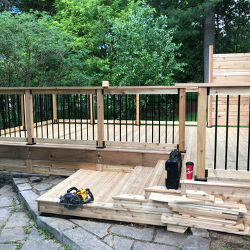 Red cedar deck with black round balusters
