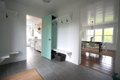 Example of a mountain style slate floor and gray floor single front door design in Montreal with a blue front door