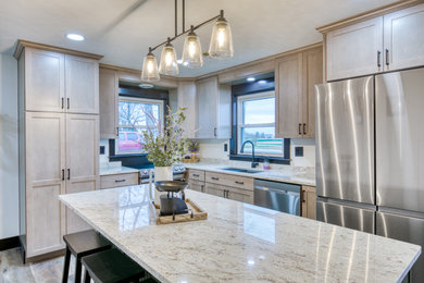 Inspiration for a mid-sized country u-shaped vinyl floor and multicolored floor open concept kitchen remodel in Baltimore with an undermount sink, beaded inset cabinets, green cabinets, granite countertops, white backsplash, granite backsplash, stainless steel appliances, an island and white countertops