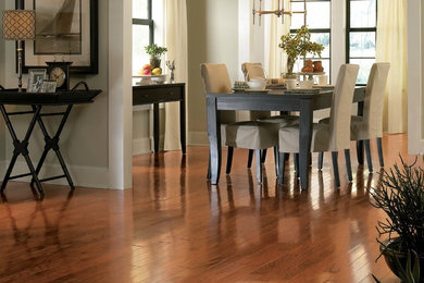 Mid-sized transitional medium tone wood floor great room photo in Minneapolis with beige walls and no fireplace