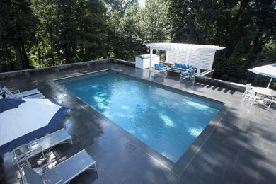 Geometric Swimming Pool with Pergola and Firepit