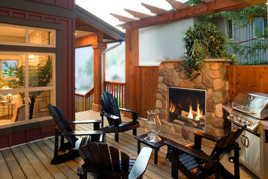Inspiration for a small arts and crafts side yard deck in Seattle with a fire feature and no cover.