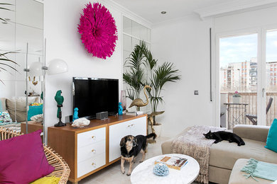 Example of a mid-sized 1950s formal and open concept living room design in Barcelona with white walls and a media wall