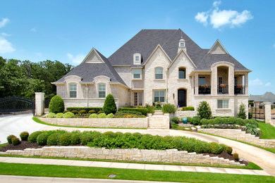 Huge transitional three-story mixed siding exterior home photo in Dallas