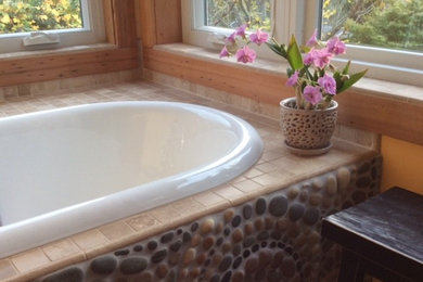 Example of a mid-sized eclectic master multicolored tile and mosaic tile drop-in bathtub design in Seattle with brown walls and tile countertops