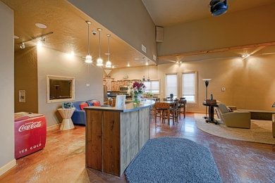 Eat-in kitchen - large traditional brown floor eat-in kitchen idea in Other with a double-bowl sink, raised-panel cabinets, distressed cabinets, stainless steel appliances and a peninsula