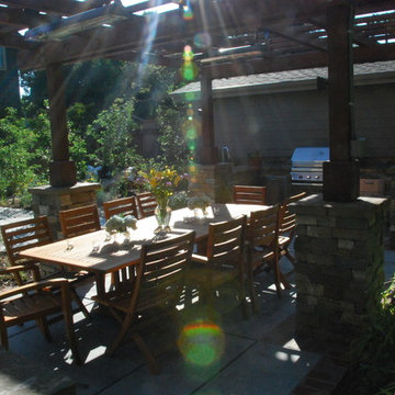 Dining patio with adjacent outdoor kitchen. Downlights and Infratech heaters in