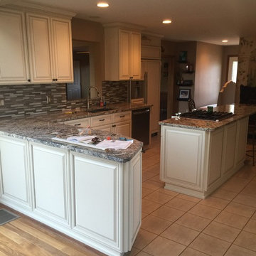 cabinet refacing--antique white with new granite and backsplash