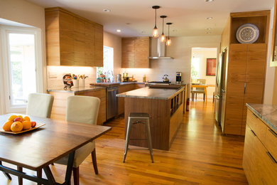 Inspiration for a mid-sized transitional u-shaped medium tone wood floor eat-in kitchen remodel in Other with an undermount sink, flat-panel cabinets, medium tone wood cabinets, quartzite countertops, white backsplash, ceramic backsplash, stainless steel appliances and an island
