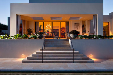 Design ideas for a large mediterranean backyard rectangular pool in Santa Barbara with tile.