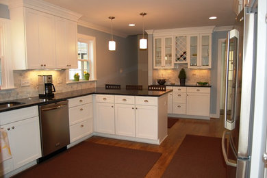 Design ideas for a large kitchen pantry in Richmond with recessed-panel cabinets and white cabinets.