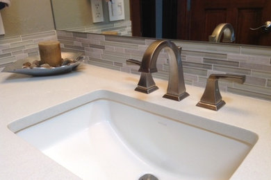 Mid-sized transitional master gray tile porcelain tile alcove shower photo in Seattle with an undermount sink, furniture-like cabinets, dark wood cabinets, quartz countertops, a two-piece toilet and gray walls