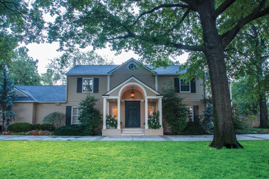 Large traditional beige two-story concrete fiberboard exterior home idea in Wichita