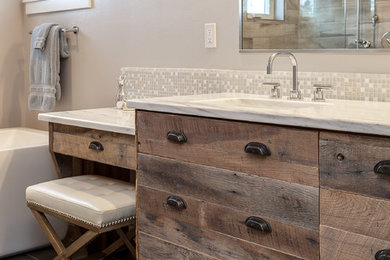 Bathroom - huge contemporary master beige tile and ceramic tile medium tone wood floor bathroom idea in Denver with flat-panel cabinets, distressed cabinets, gray walls, an undermount sink and granite countertops