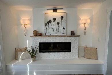 Living room - mid-sized brown floor living room idea in Los Angeles with white walls