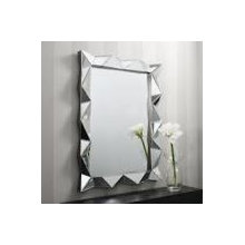 Framed wall mirror and mirrored furniture.