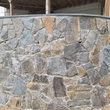 C-Stamped concrete patio with a wall