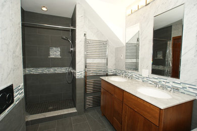 Inspiration for a mid-sized contemporary master blue tile, white tile and matchstick tile porcelain tile alcove shower remodel in Boston with flat-panel cabinets, medium tone wood cabinets, gray walls and an undermount sink