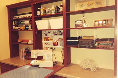 Craft room - mid-sized craftsman built-in desk craft room idea in Dallas with beige walls
