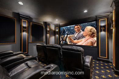 Small elegant enclosed carpeted and black floor home theater photo in Philadelphia with gray walls and a projector screen