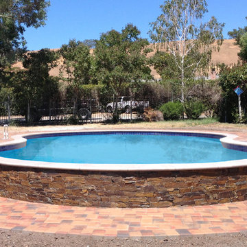 Pool with Copper Loose Stone Veneer and Pavers