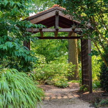 Naturalistic back yard landscaping with arbor