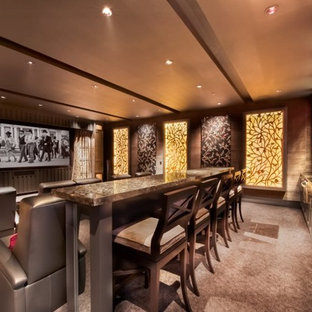 Large trendy enclosed carpeted and brown floor home theater photo in San Diego with brown walls and a projector screen