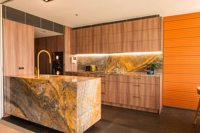 This is an example of a large contemporary open plan kitchen in Sydney with an undermount sink, dark wood cabinets, marble benchtops, multi-coloured splashback, marble splashback, with island and multi-coloured benchtop.