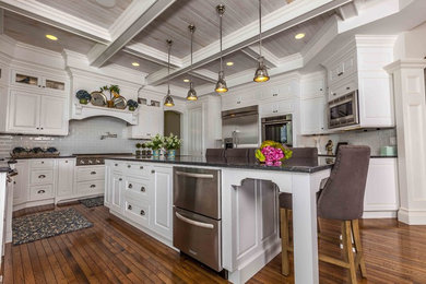 Kitchen - traditional kitchen idea in Seattle with stainless steel appliances and subway tile backsplash