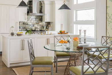 Transitional medium tone wood floor kitchen/dining room combo photo in Boston with white walls